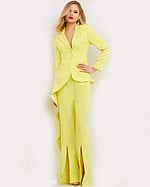 Model wearing Jovani 07209 citrus dress with notched lapel and wide-leg trousers front view.