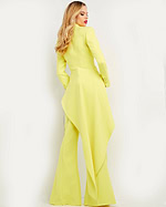 Model wearing Jovani 07209 citrus ensemble with blazer and trousers, back view