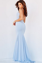 Model wearing Jovani 07297 in light blue, back view showing low back with embellishments.