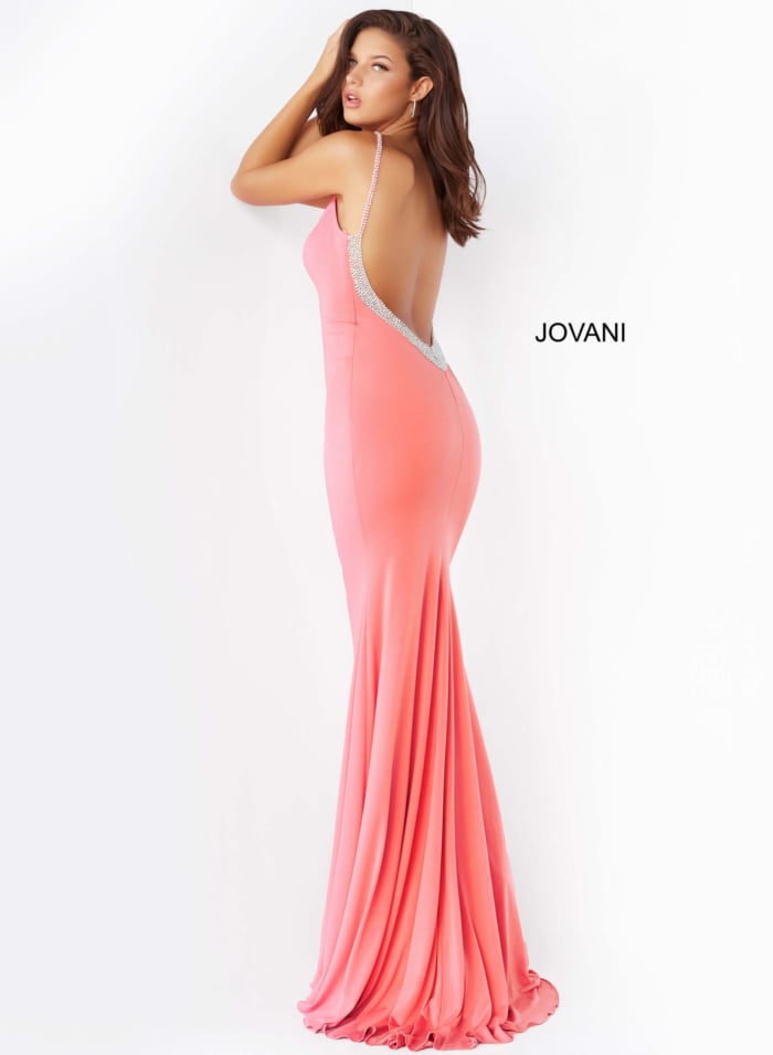 Model showcasing the back of Jovani 07297 pink dress with embellished open V back.
