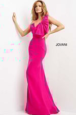 Model in Jovani 07306, fuchsia gown with asymmetric neckline and bow, side view.