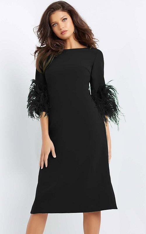 Model wearing Jovani 07341 black midi dress with feather-trimmed sleeves, front view.
