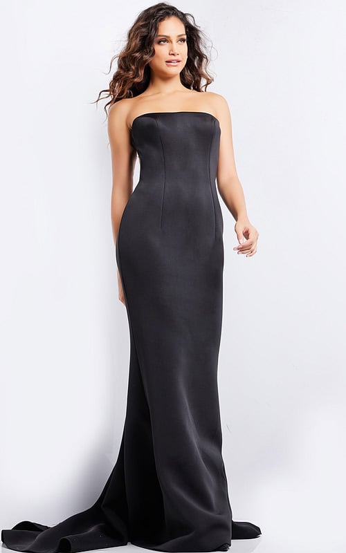 Model wearing Jovani 07427 elegant black gown with a strapless neckline and fitted silhouette.