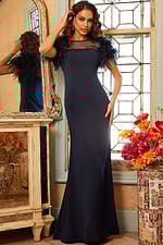 Model wearing Jovani 07432 navy dress with feathered sleeves and sheer neckline.