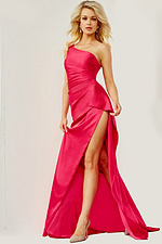 Model posing in Jovani 07536 vibrant pink dress, highlighting asymmetrical neckline.