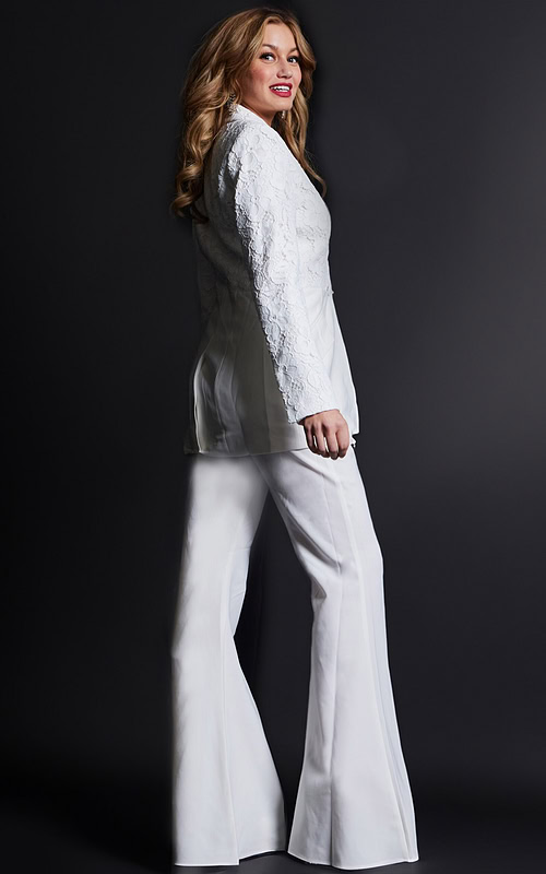 Model wearing Jovani 07551 ivory lace blazer with trousers, back view