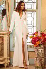 Jovani 07552 ivory dress worn by model, showing high slit and lace sleeves.