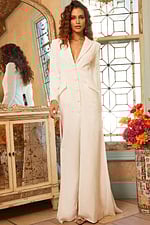 Front view of model in Jovani 07552 ivory dress with button-front design.