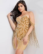 Back view of model wearing Jovani 07577 nude dress with bead embellishments.