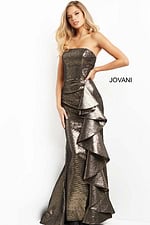 Model in Jovani 07582 metallic brown gown with a focus on the ruffle detail.