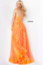 Model wearing Jovani 07901 orange gown showcasing the back