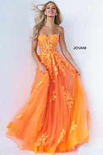 Model wearing Jovani 07901 orange gown with floral design