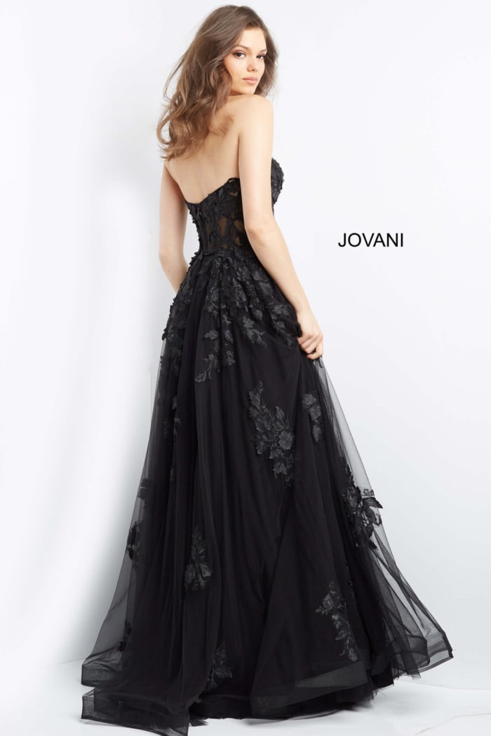 Model wearing Jovani 07901 black gown with exquisite back detail
