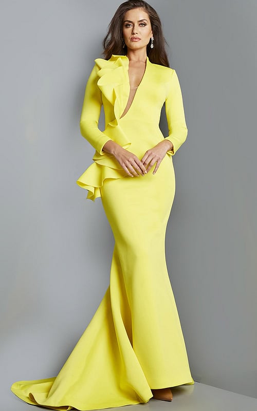 Model wearing Jovani 07934 yellow gown with ruffle detail, front view
