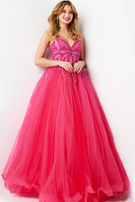 Model in Jovani 07946 fuchsia ball gown with sweetheart neckline and bead embellishments