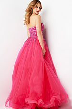 Back view of Jovani 07946 fuchsia ball gown displaying beaded bodice and full skirt.