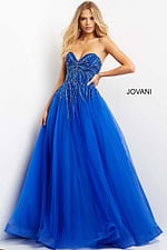 Model wearing Jovani 07946 royal dress with voluminous tulle skirt and beaded details