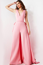 Model showing Jovani 08000 pink jumpsuit in a dynamic pose with wide-leg pants.