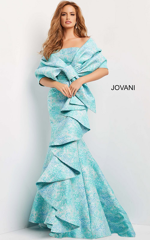 Model wearing Jovani 08093 gown with mermaid silhouette and ruffle details in blue multi-color from the front.