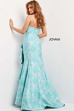 Back view of model in Jovani 08093 blue multi-color dress with elegant mermaid silhouette.