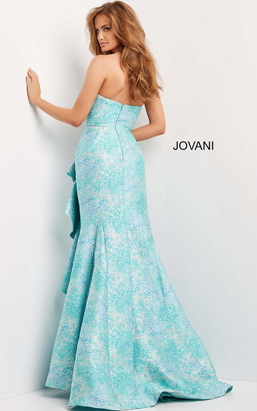 Back view of model in Jovani 08093 blue multi-color dress with elegant mermaid silhouette.