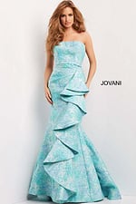 Front view of Jovani 08093 blue mermaid gown with cascading ruffle details.