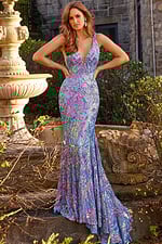 Model in Jovani 08099 dress, front view, showing deep V-neck and vibrant blue pattern.