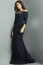 Side view of model in Jovani 09623 navy gown, showing off-shoulder cutout.