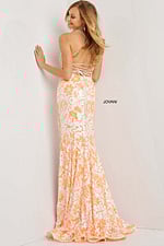 Back view of model in Jovani 08255 ivory dress with lace-up design.