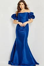 Model wearing Jovani 08361 blue mermaid gown with off-shoulder puff sleeves.