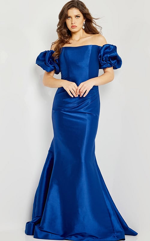 Model wearing Jovani 08361 blue mermaid gown with off-shoulder puff sleeves.