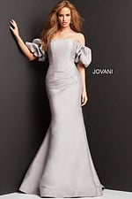 Model wearing Jovani 08361 gown, showing puff sleeves and mermaid silhouette.