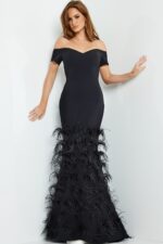 Model in Jovani 08384 black mermaid gown showcasing feather detailing.