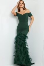 Model wearing Jovani 08384 green off-the-shoulder mermaid gown with feather details.