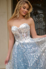 Model showcasing Jovani 08417 blue dress top front detail