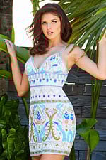 Model wearing Jovani 08447 dress in white with a plunging neckline