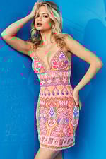 Model wearing Jovani 08447 light fuchsia dress with ornate bead patterns.
