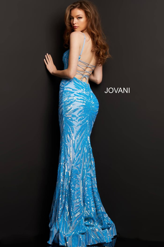 Back view of model in Jovani 08481 blue gown with lace-up design.