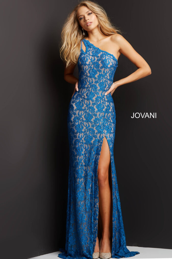 Model in Jovani 08515 blue lace dress with asymmetrical neckline and slit