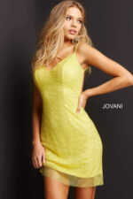 Model wearing Jovani 08530 yellow mini dress with V-neckline and sleek silhouette