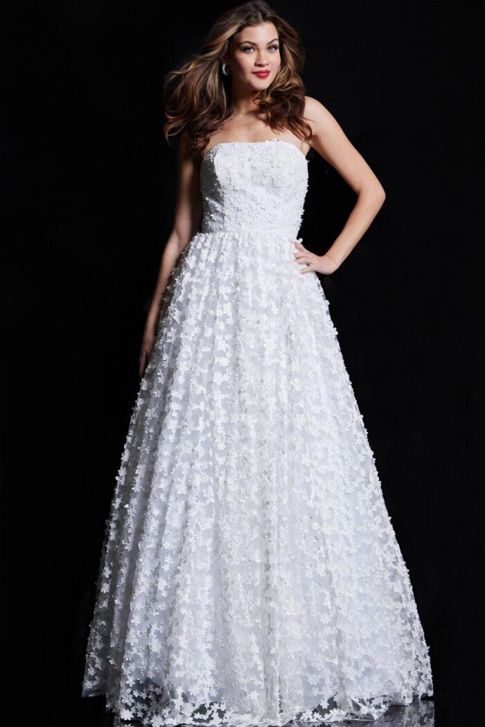 Model wearing Jovani 08536 ivory gown with floral lace and A-line silhouette from the front.
