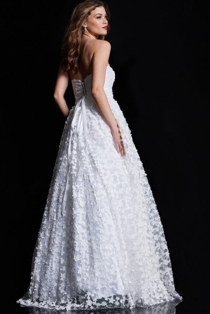 Back view of Jovani 08536 ivory gown with lace-up closure and floral lace design.