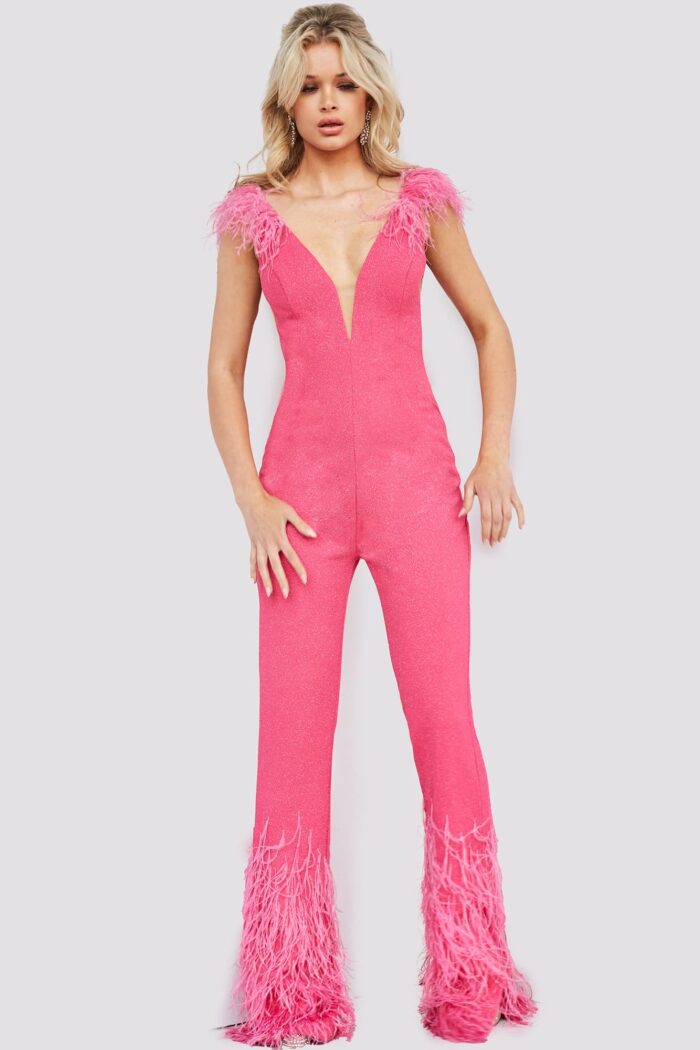 Model in Jovani 08554 full-length pink jumpsuit with feather detailing.