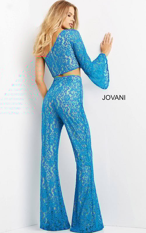 Model wearing Jovani 08693 blue lace set highlighting back design.