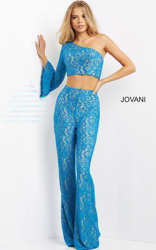 Model wearing Jovani 08693 blue lace ensemble with asymmetrical neckline.