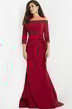 Jovani 08699 red off-the-shoulder gown with ruched waist detail worn by model.