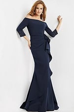 Model in Jovani 08699 navy gown featuring a mermaid silhouette and ruched waist.