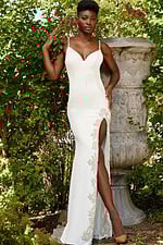 model wearing Jovani 09009 white gown with embellished high slit