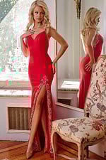 model wearing Jovani 09009 red gown with embellishments