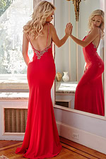 model wearing Jovani 09009 red gown showing back view
